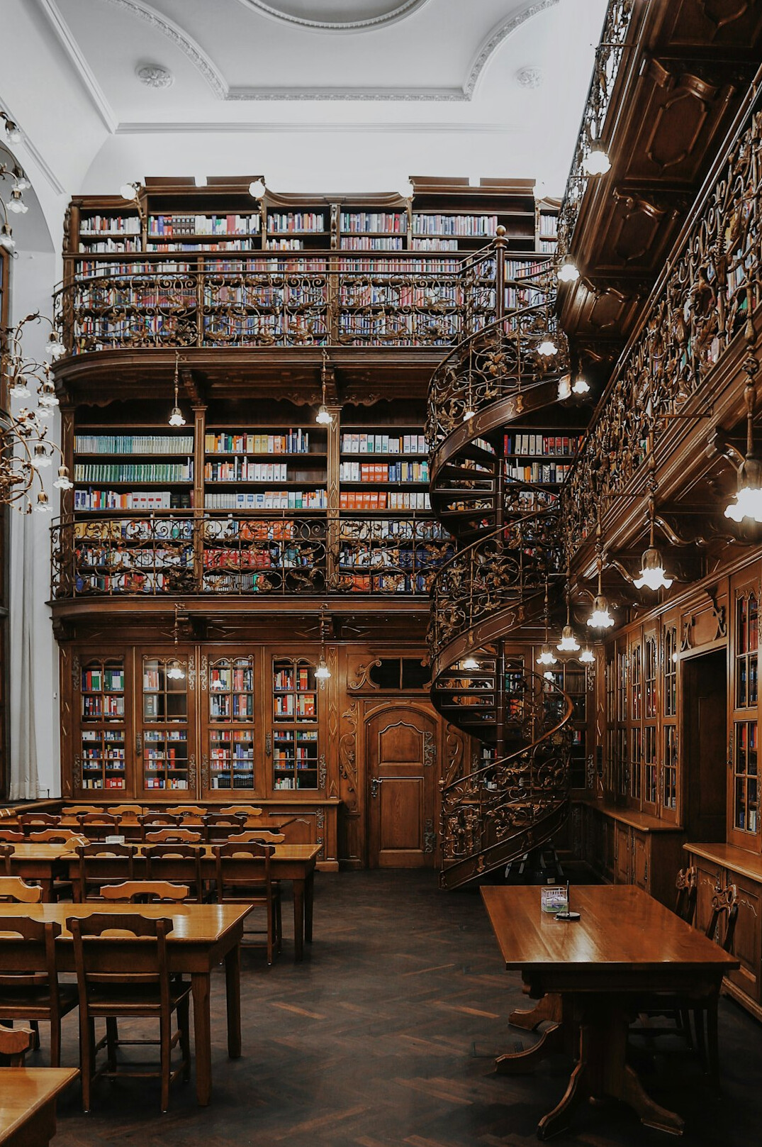 Classic library with tall wooden shelves full of books